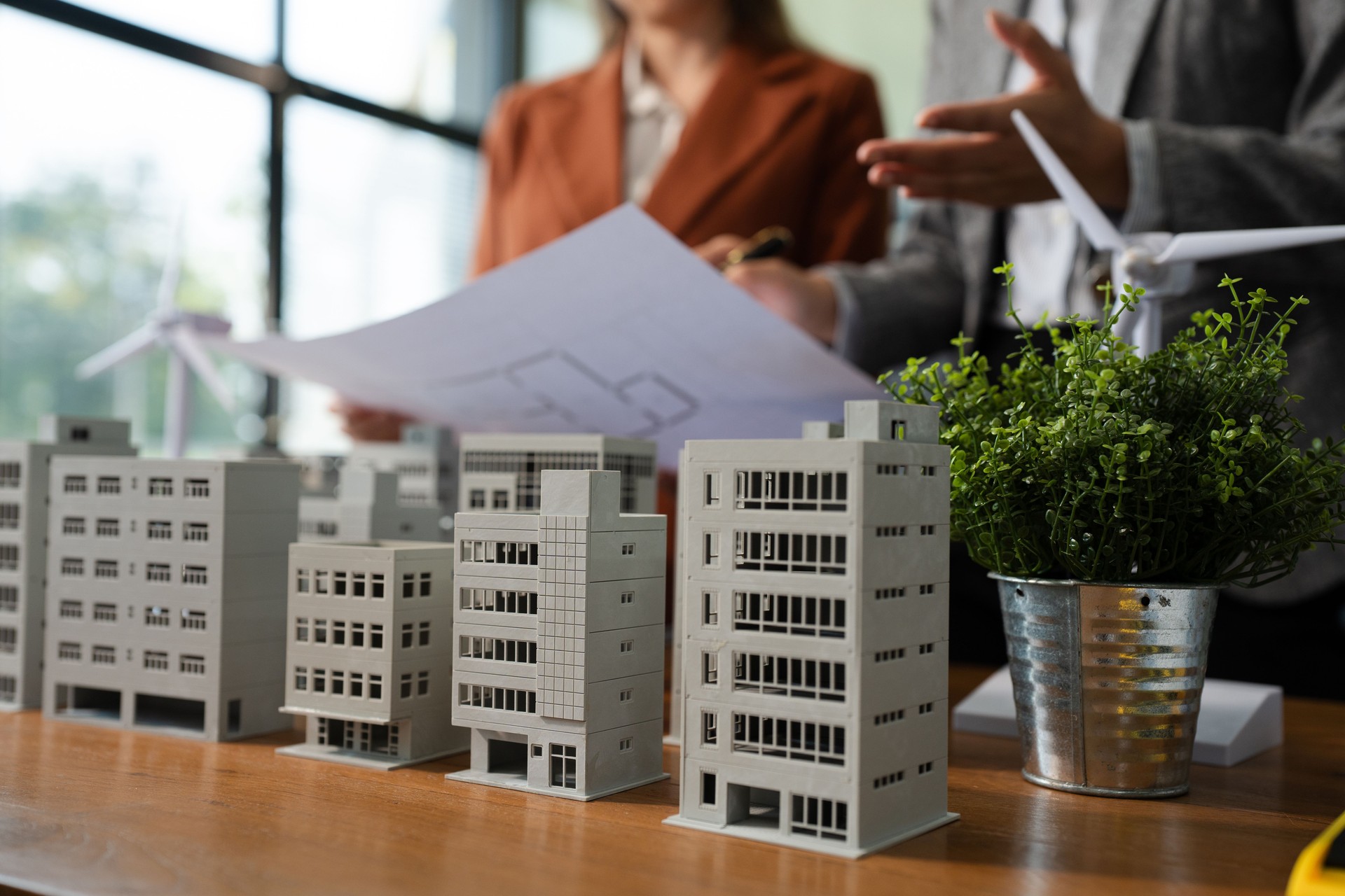 House model with agent asking costumer for contract to buy, get insurance or loan real estate or property